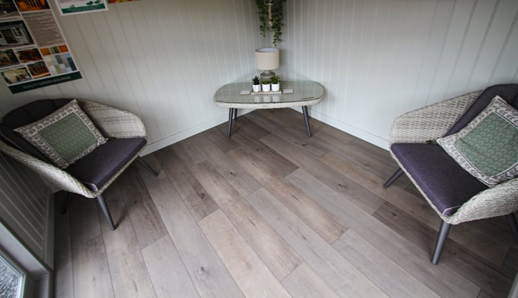Wolfsback Oak deluxe laminate floor fitted to a Studio Corner